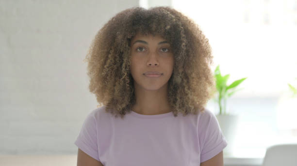 istock Young African Woman Looking at the Camera 1465120962