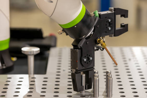 istock automated robotic arm grabbing pieces of iron 1465121228