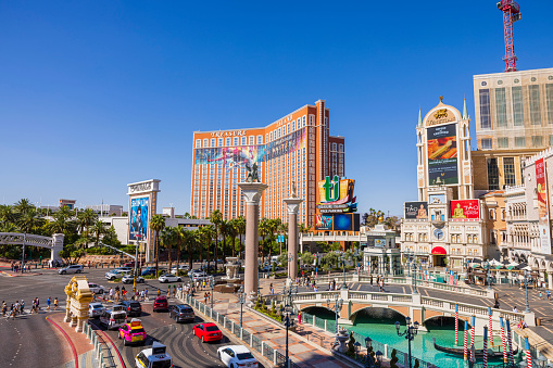 Cars stand at an intersection on The Strip, Las Vegas Boulevard in Las Vegas, Nevada, USA on a cloudy day.