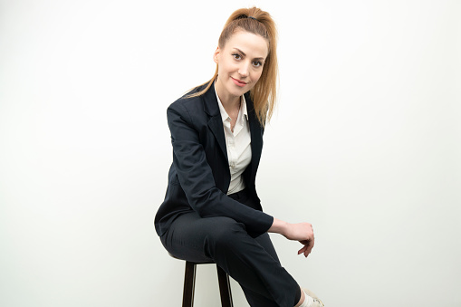 portrait of young business woman on white background