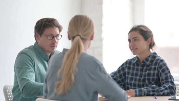 istock Multiethnic Group of People Talking during Meeting 1465124986