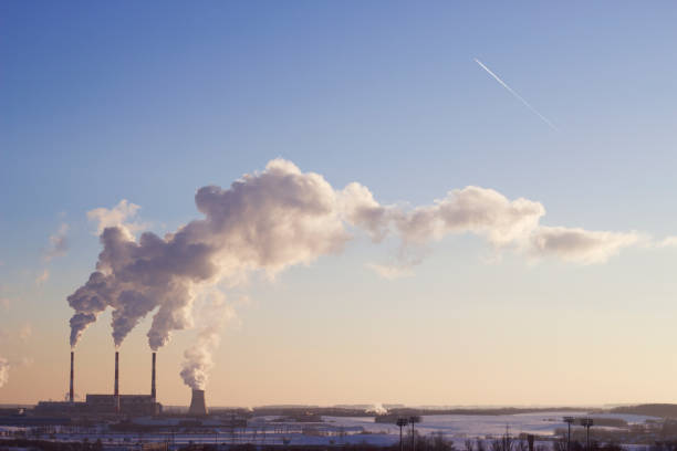 istock Smoke from a chimney in sunny winter evening 1465125852