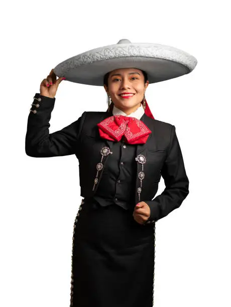 young good looking latin hispanic musician feminine mariachi wearing a mexican white hat or sombrero