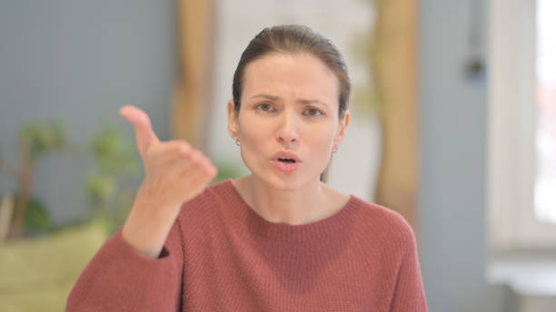 istock Distraught Beautiful Woman Talking in Anger and Stress 1465136318