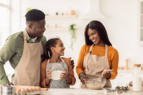 istock Black Family Baking Making Dough For Cookies In Kitchen Indoor 1465137820