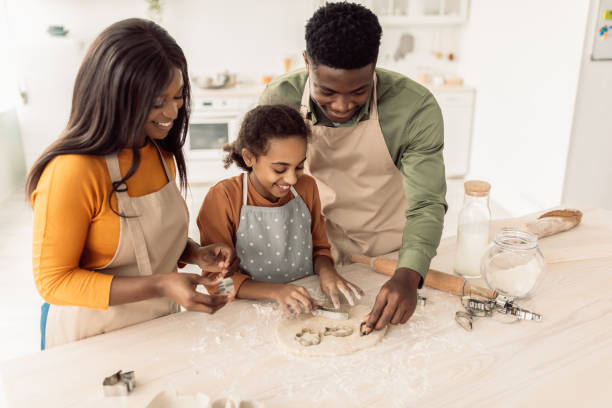 istock African American Family Making Cookies Using Baking Forms In Kitchen 1465138153