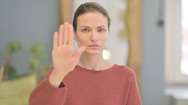 istock Denying Beautiful Woman Asking to Stop with Hand Gesture 1465138936