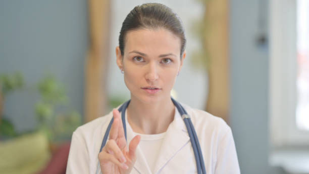 istock Female Doctor Talking on Online Video Chat 1465139621