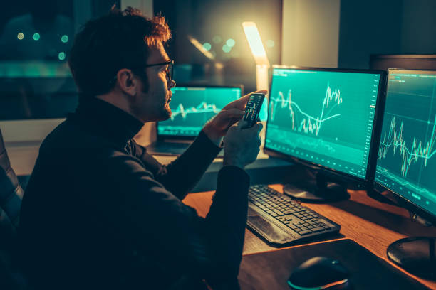 istock Nighttime Finance A Guy Analyzing Market Trends on a Mobile Device 1465145746