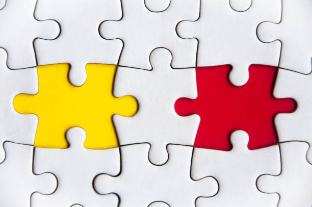 istock Missing jigsaw puzzle in red and yellow color with customizable space for text or ideas. Copy space. 1465149726