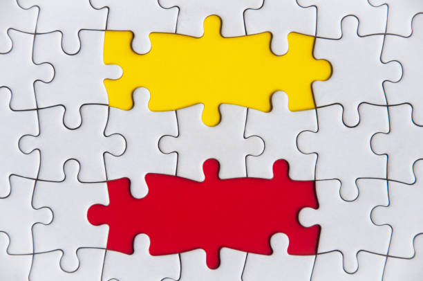 istock Missing jigsaw puzzle in red and yellow color with customizable space for text or ideas. Copy space. 1465149729
