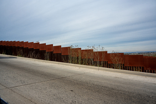 Evening Cloudscape Drone View of Border Wall Between San Diego California USA and Tijuana Baja Califronia Norte