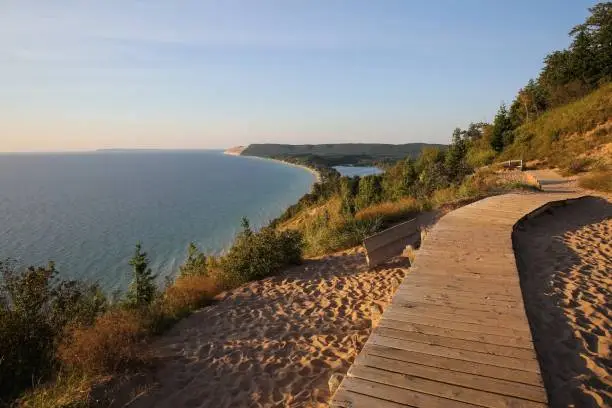 Photo of beautiful sunset scenery at the Empire Bluff Scenic Lookout, overlooking Lake Michigan, the Sleeping Bear Dunes, and the Manitou Island