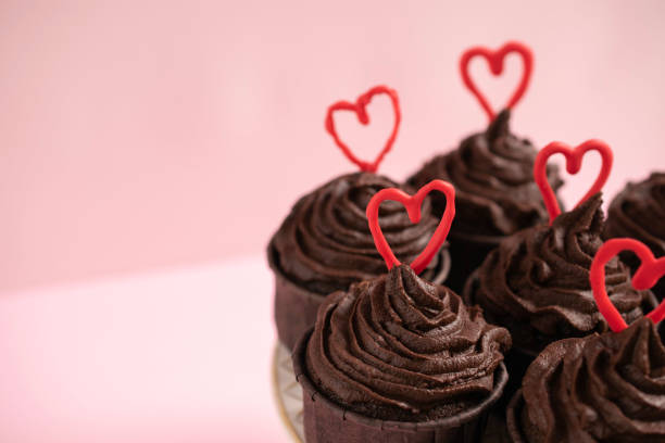 istock Chocolate cupcakes with ganache frosting and a heart-shaped chocolate 1465162944