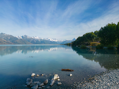 Overhead view of Lake Pukaki and Southern Alps with Mt Cook reflecting through Lake Pukaki, South Island, New Zealand.