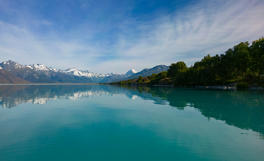 Overhead view of Lake Pukaki and Southern Alps with Mt Cook reflecting through Lake Pukaki, South Island, New Zealand.