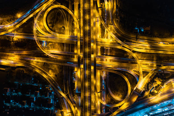 istock Expressway road. Multilevel junction motorway top view, Road traffic an important infrastructure in Thailand. 1465176163