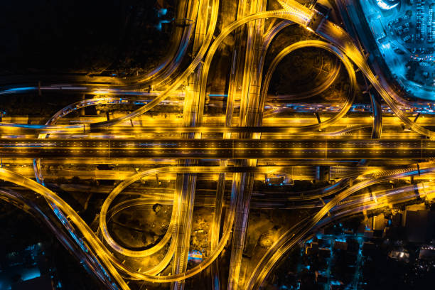 istock Expressway road. Multilevel junction motorway top view, Road traffic an important infrastructure in Thailand. 1465176165
