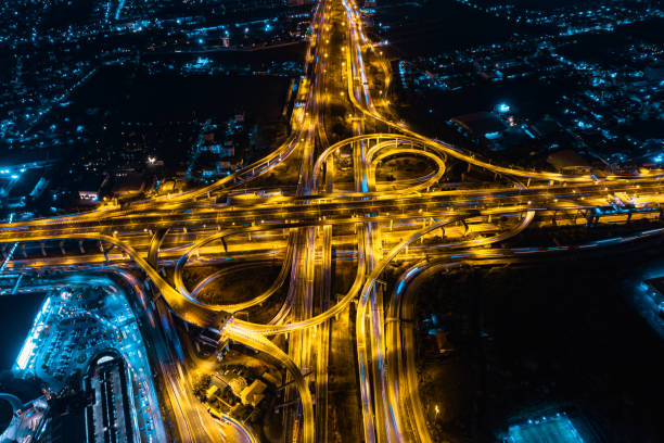 istock Expressway road. Multilevel junction motorway top view, Road traffic an important infrastructure in Thailand. 1465176172