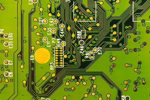 Green computer electronic circuit board close-up view