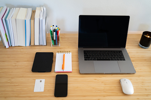 Home office desk with computer and cellphone on the table