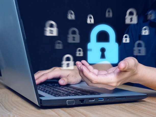 istock cyber security concept Man's hand showing a padlock icon 1465190964