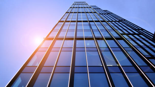 istock Glass modern building with blue sky background. Low angle view and architecture details. 1465193754