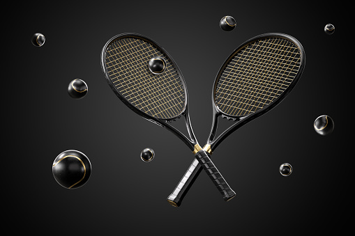 Black Leather Tennis Rackets And Balls With Gold Details On Black Background. Sport Content.