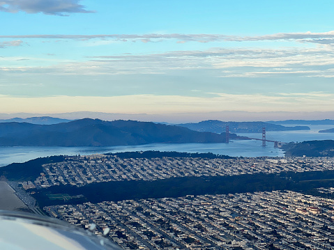 Aerial view of city skyline and calm bay at sunset, San Francisco
