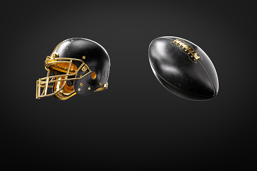 Leather Black And Golden American Football Ball And Helmet On Black Background.