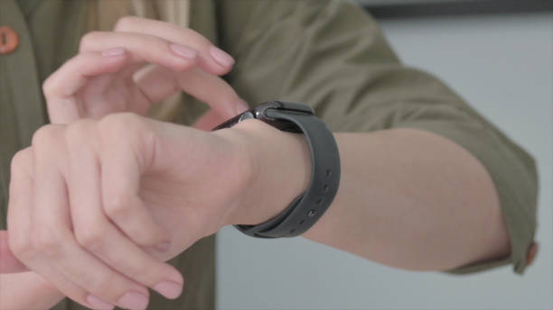 istock Close Up of Woman Using Smart Watch 1465202123