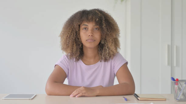 istock Young African Woman Looking at the Camera 1465202189