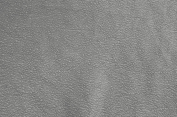 istock An abstract surface of old gray synthetic fabric. 1465203231