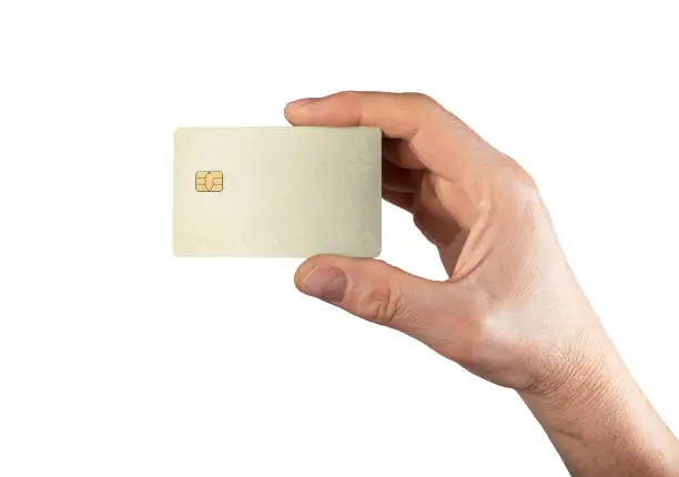 Bank card mock up, sample in male hand isolated on white background. Blank debit credit bankcard with chip. High quality photo