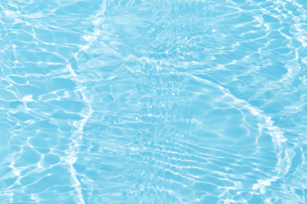 istock Defocus blurred transparent blue colored clear calm water surface texture with splashes and bubbles. Trendy abstract nature background. Water waves in sunlight with copy space. Blue watercolor shining 1465207342