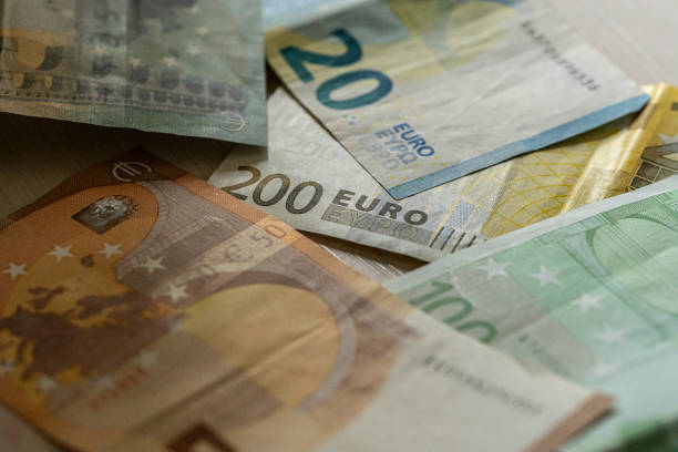 istock Money saving. Euro paper currency. 1465211942