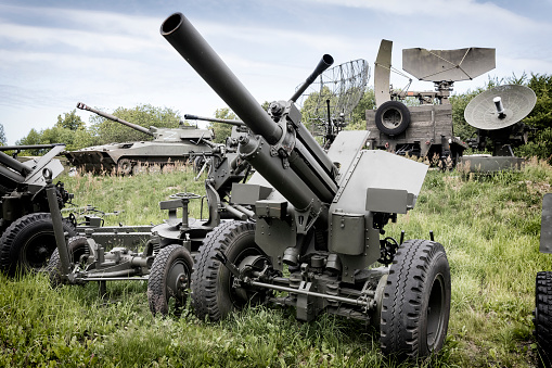 american howitzer stands on a battlefield