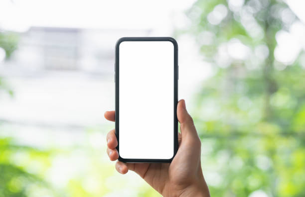 istock Hands holding smartphone with mockup of blank screen. 1465218660