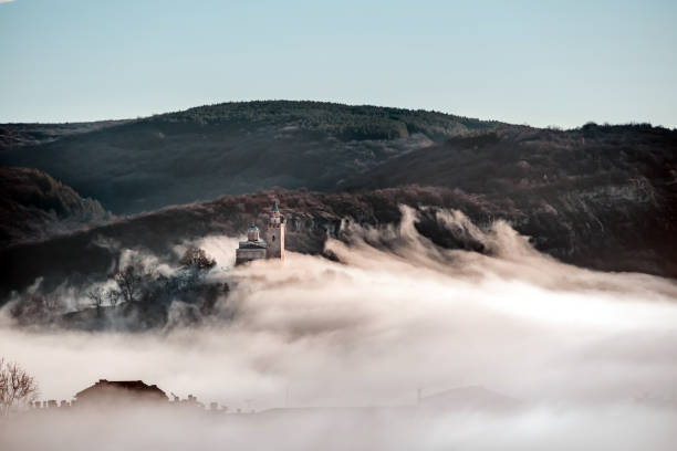 istock Foggy landscape of an old tower 1465220884