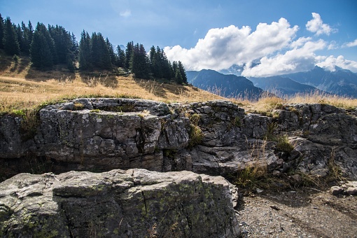 A landscape of rocks in the Le Prarion mountains on a sunny day in Les Houches, France