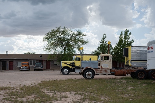 Kingman, United States – October 05, 2022: The old Kenworth and Peterbilt trucks abandoned in the waste ground in Kingman, US