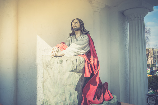 This stock image features an Easter-themed image of a glowing cross, radiating divine light, set against a dark background. The camera zooms in on the cross, bringing it closer into view, and highlighting its intricate details and illumination. This stock image captures the essence of the Christian celebration of Easter and can be used as a background for church services, religious events, or as part of visual displays for Easter-themed productions.