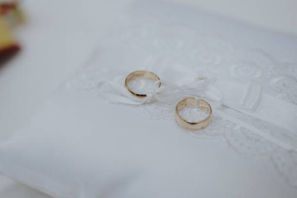 istock Selective focus shot of golden wedding rings 1465224772