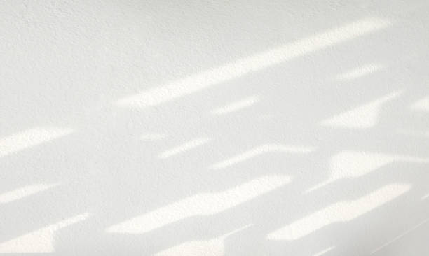 istock Abstract shadow of window on white concrete wall 1465224776