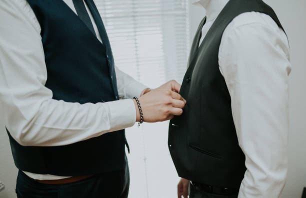 istock Groomsman helping the groom getting ready for the wedding ceremony 1465224792