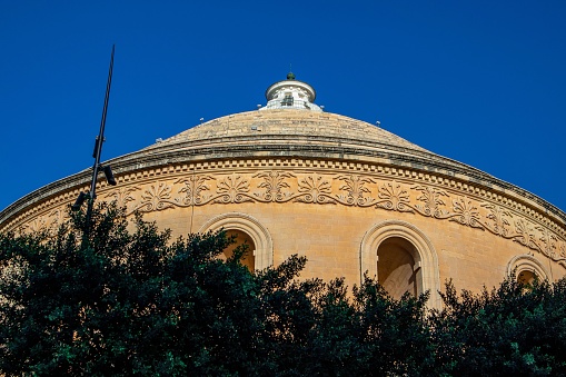An old architectural building under the blue sky in Malta