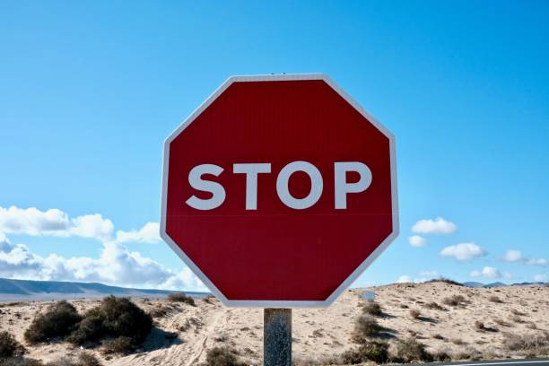 istock Red stop sign in the desert 1465227090