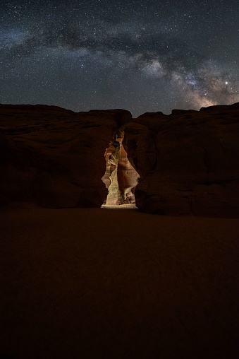 The entrance of famous Antelope Canyon under a mesmerizing starry sky in Arizona, USA