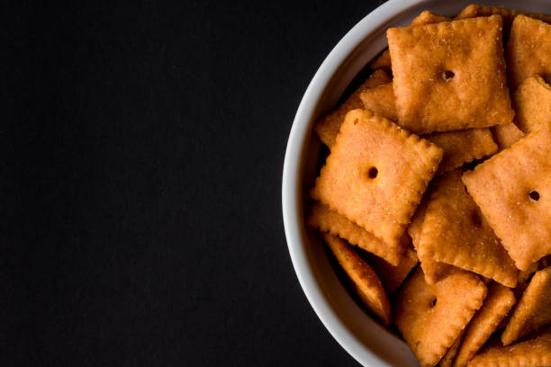 istock Top view of crackers in the bowl in black background with copy space 1465228679