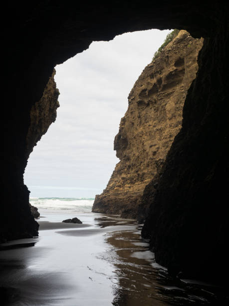 istock from darkness of Piha Blowhole cave to ocean 1465228749